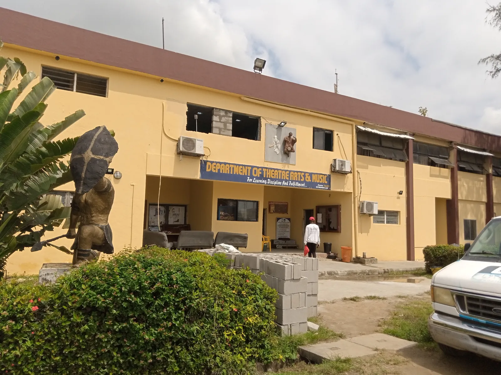 The yellow Department of Theatre Arts and Music building at Lagos State University, Ojo